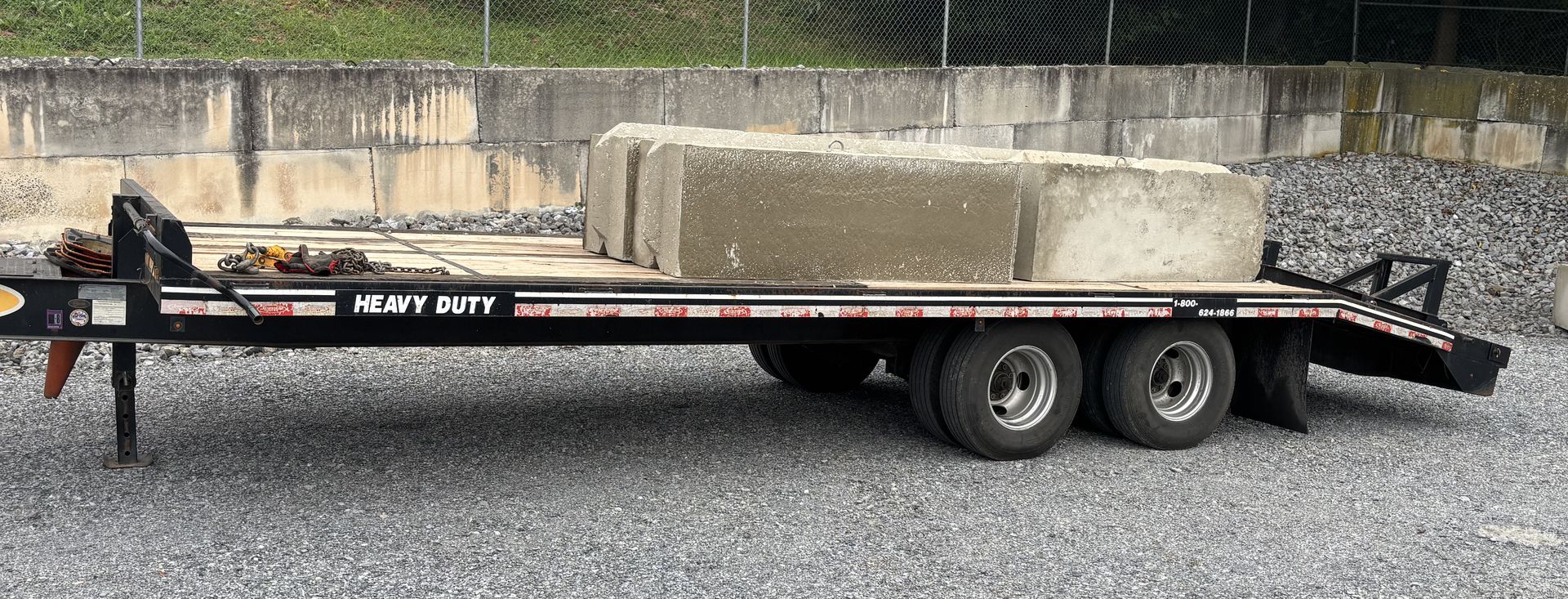 Concrete blocks loaded on trailer for retaining wall installation