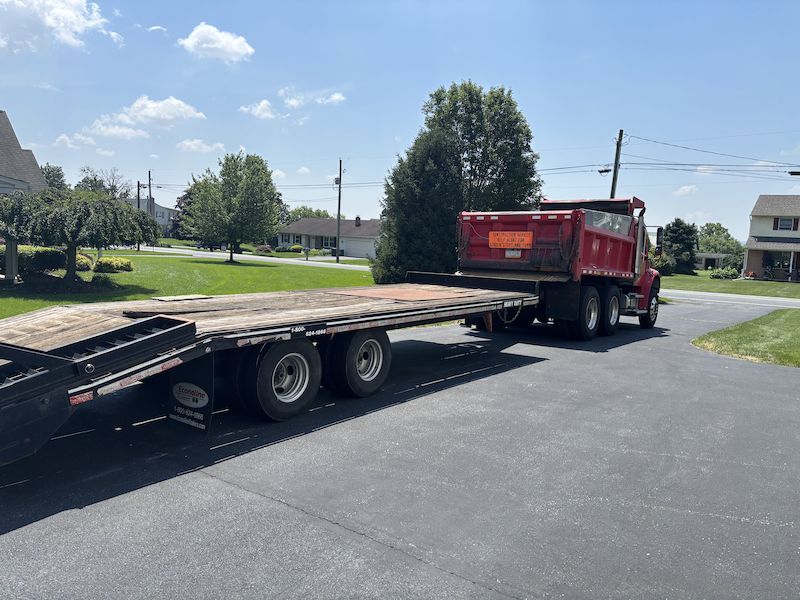 Flatbed trailer hauling equipment