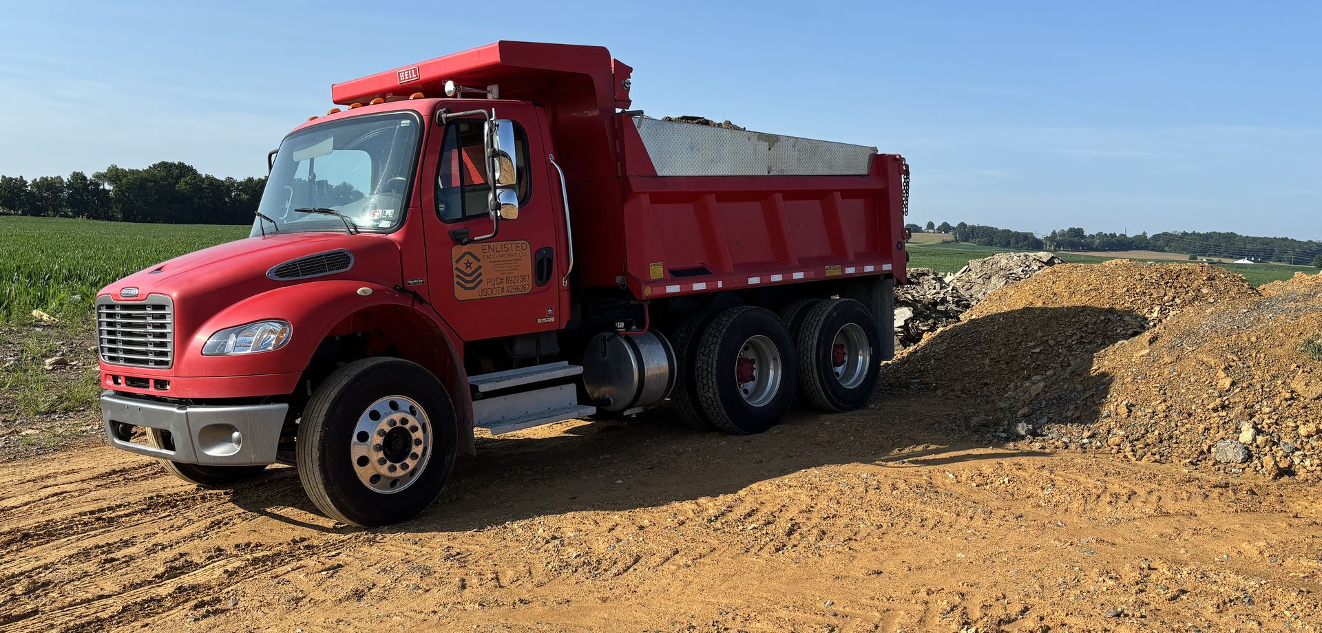 Dump truck hauling stone and aggregate